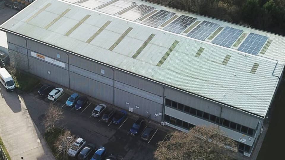 Arial view of a warehouse with solar panels installed