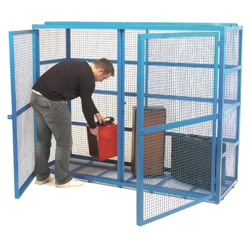 Equipment being loaded into a steel mesh safety cage